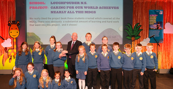 Loughfounder NS , Co Kerry receiving their throphy from the Minister for Foreign Affaris and Trade, Charlie Flanagan at the Our World Awards finals