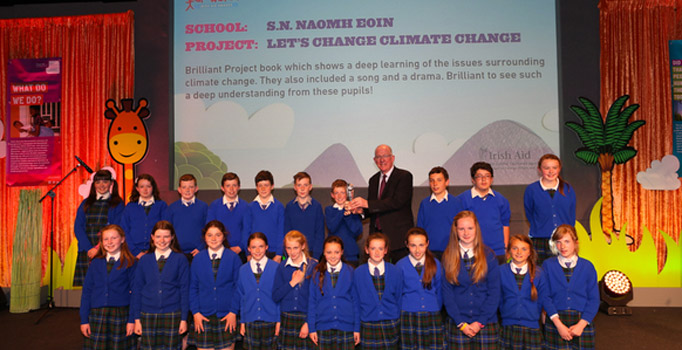 Scoil Naomh Eoin receiving their throphy from the Minister for Foreign Affairs and Trade, Charlie Flanagan at the Our World Awards finals.