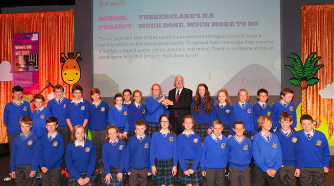 Tubberclare NS, Co Westmeath receiving their throphy from the Minister for Foreign Affairs and Trade, Charlie Flanagan at the Our World Awards finals