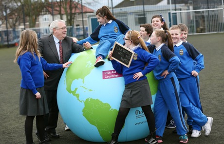 Minister Costello with students from Gaelscoil Bharra in Cabra at the launch of Our World Irish Aid Awards. 