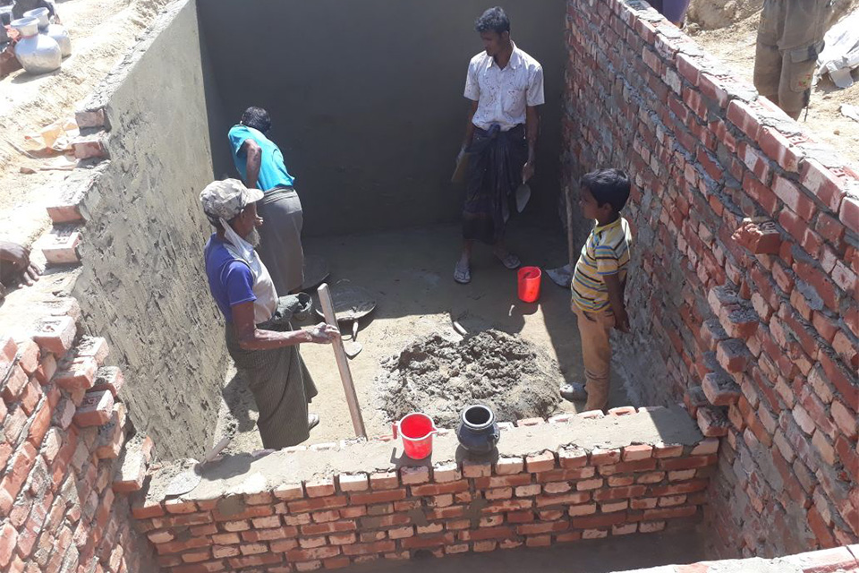 Contractors constructing Toilet Septic tanks for treating human waste